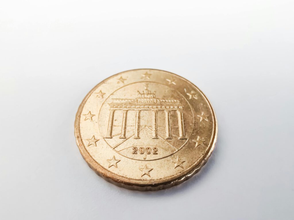 A detailed view of a 2002 Euro coin featuring the Brandenburg Gate, emphasizing currency and design.